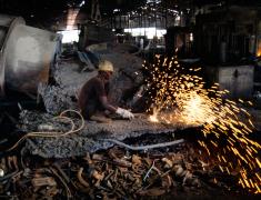 metal worker using electric equipment uganda